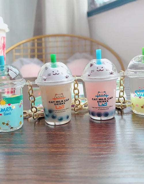 Load image into Gallery viewer, Creative Floating Unicorn Milk Tea Cup Bottle Keychain Cute Fruit Daisy Cat Bubble Tea Quicksand Sequins Liquid Car Keys Chain
