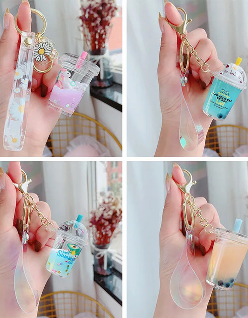 Load image into Gallery viewer, Creative Floating Unicorn Milk Tea Cup Bottle Keychain Cute Fruit Daisy Cat Bubble Tea Quicksand Sequins Liquid Car Keys Chain
